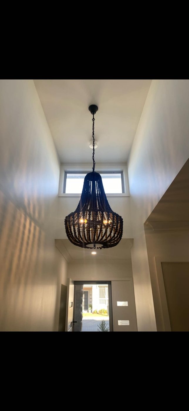 Chandelier hung in a double-height void